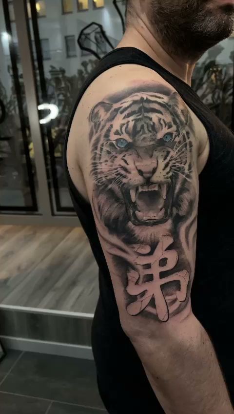 a tiger narben tattoo on the arm, paderborn, germany