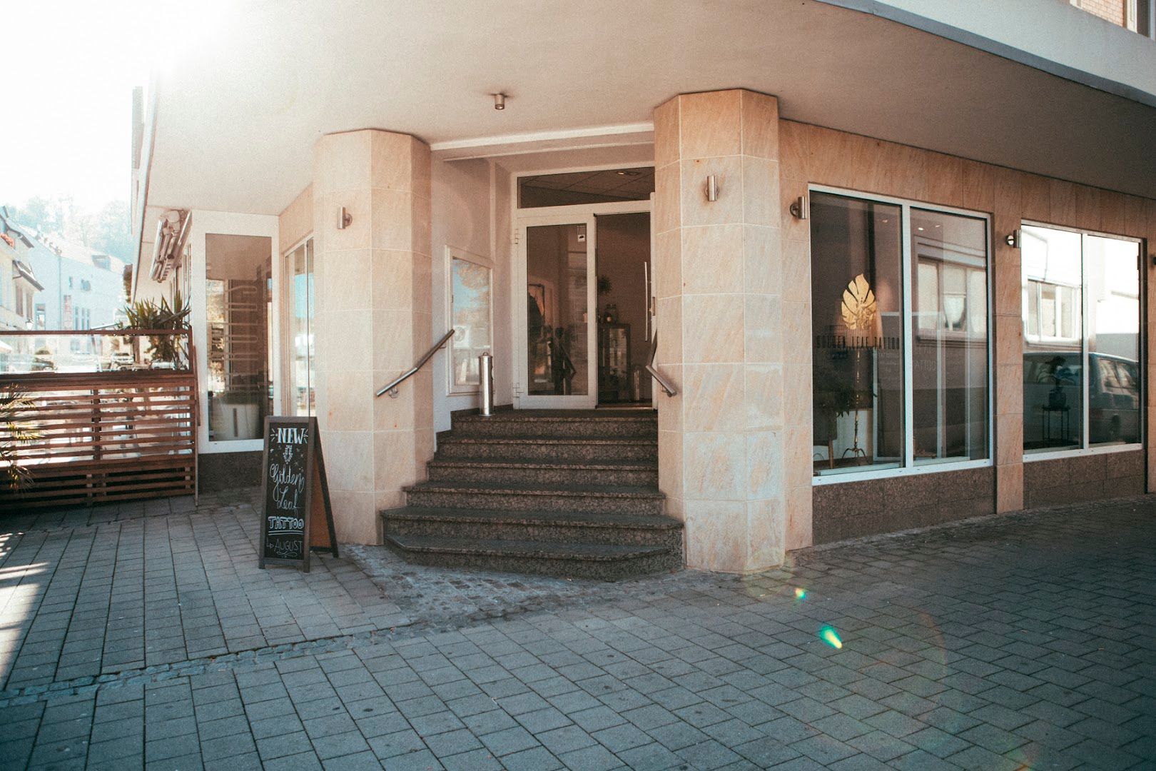 a building with a large patio and a staircase