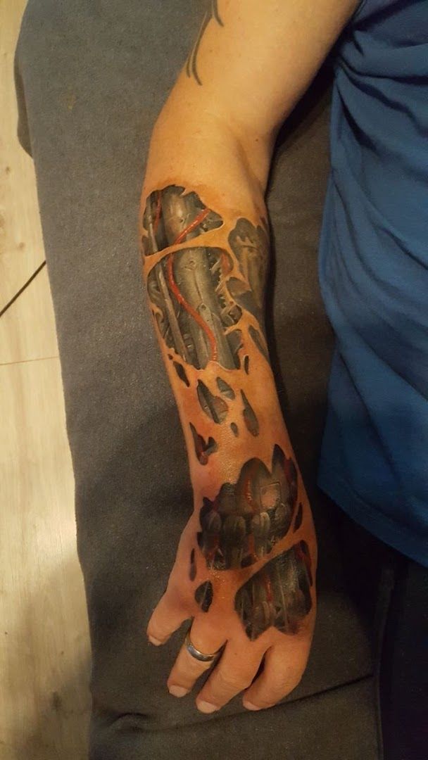 a man with a cover-up tattoo on his arm, augsburg, germany