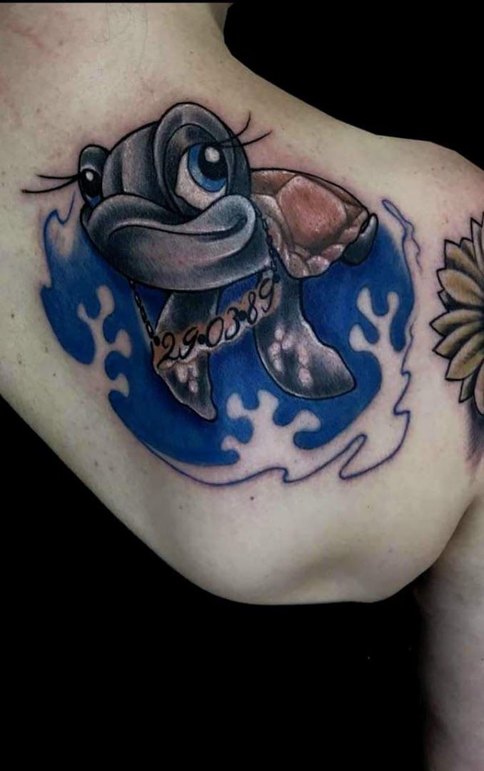 a cover-up tattoo of a baby elephant and a flower, teltow-fläming, germany