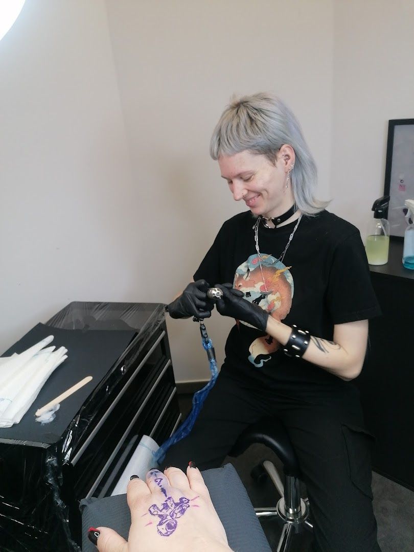 a woman getting her nails done by a mani