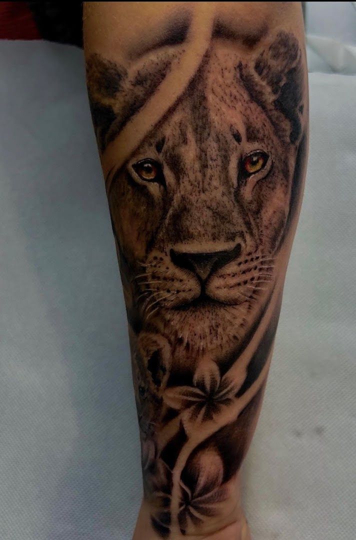 a lion cover-up tattoo on the leg, duisburg, germany