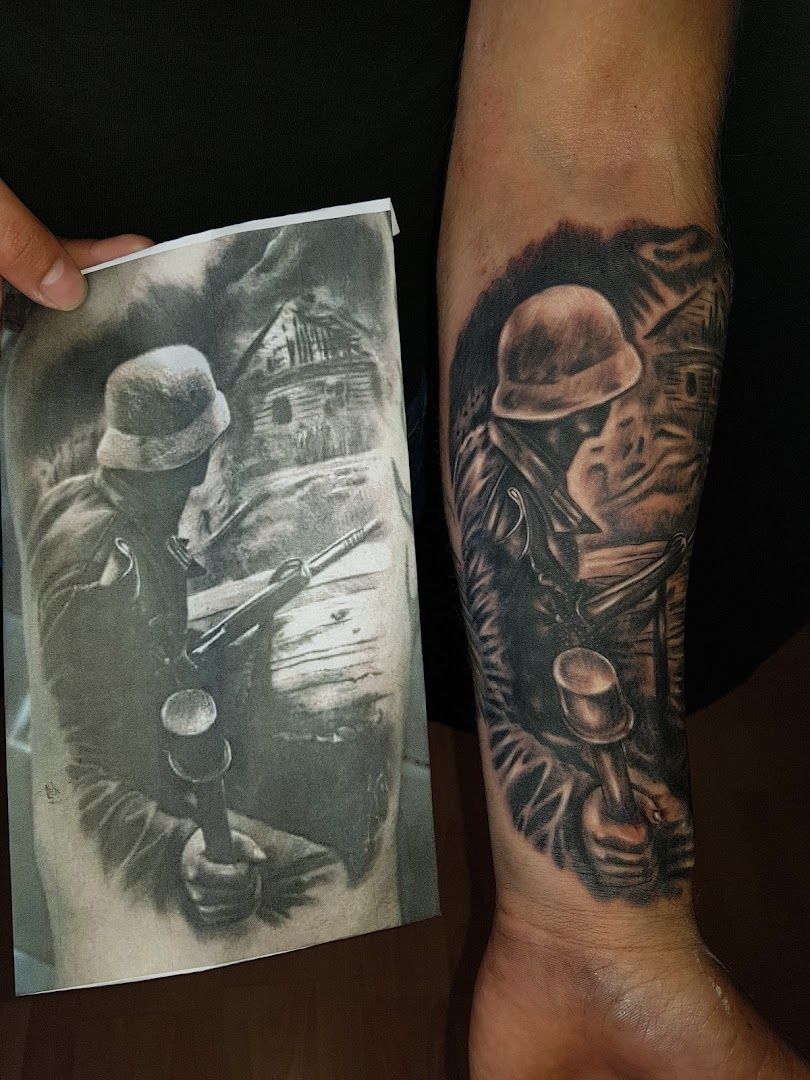 a man with a cover-up tattoo on his arm, gütersloh, germany