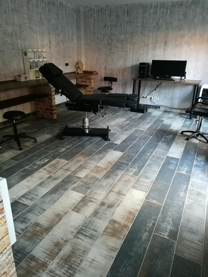 a room with a wooden floor and a chair