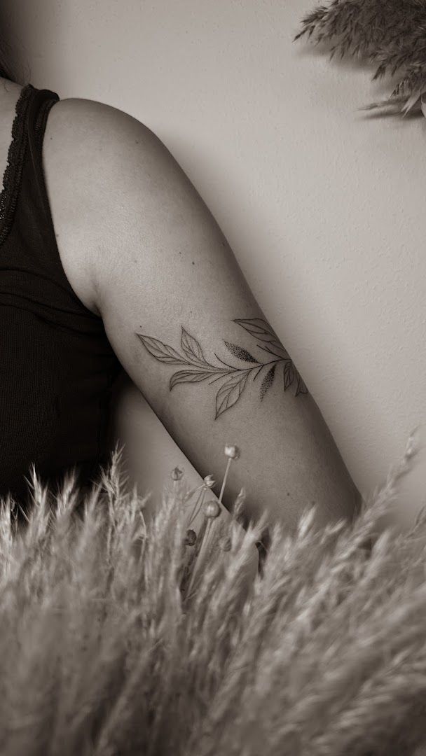 a woman with a narben tattoo on her arm, vulkaneifel, germany
