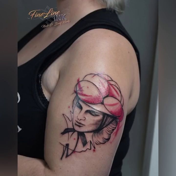 a woman with a red hat and a black and white narben tattoo, fulda, germany