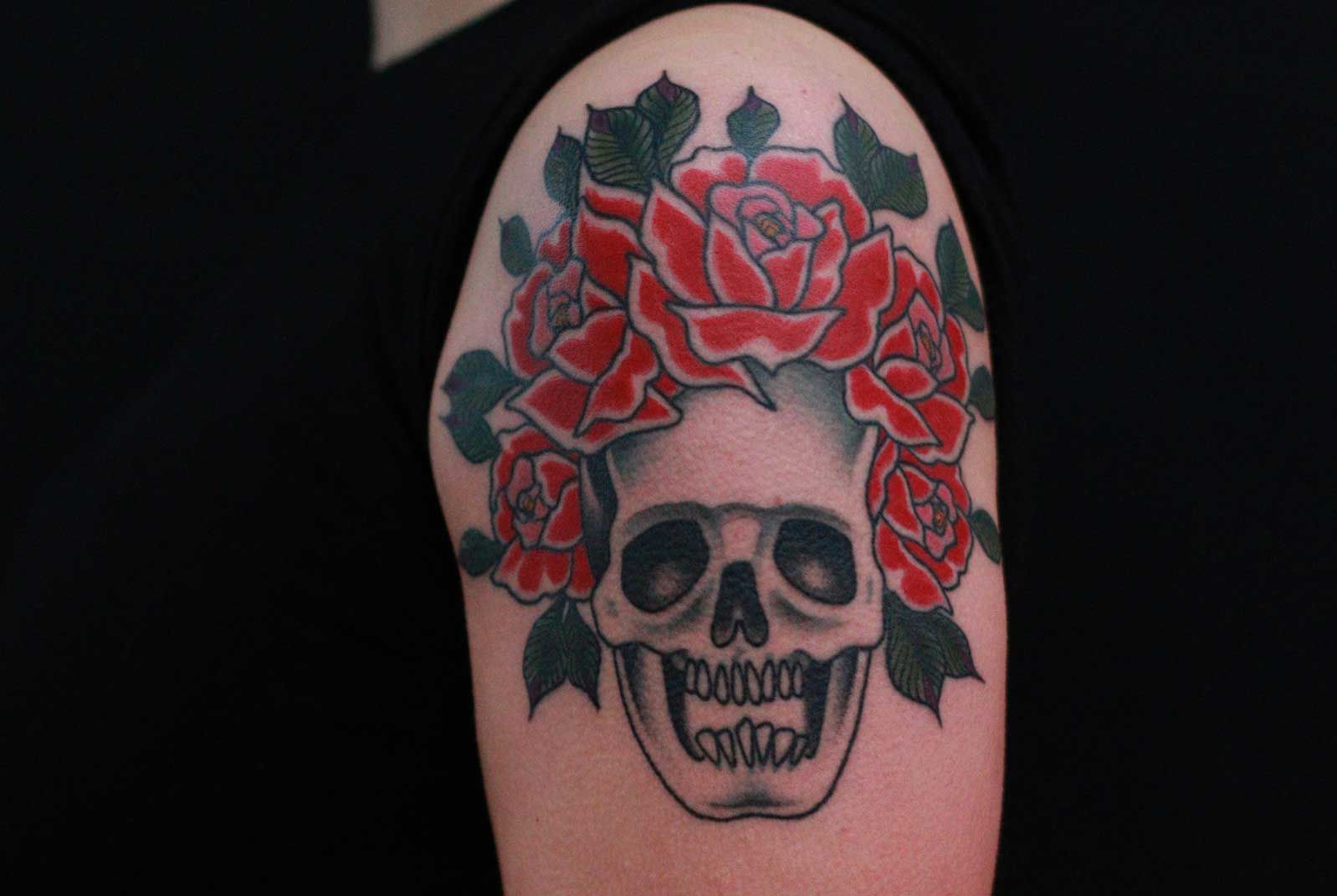 a skull with roses on it's head