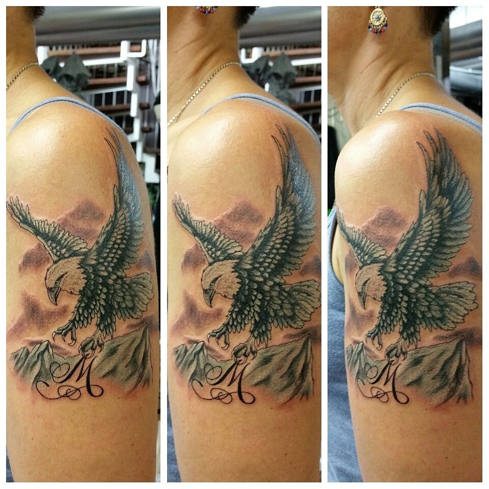 a cover-up tattoo of an eagle with the letter m on it, rhein-neckar-kreis, germany