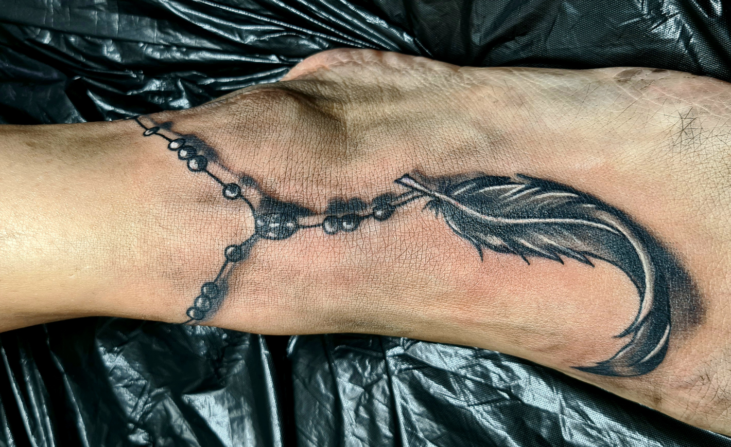 a man's hand with a cover-up tattoo on it, main-kinzig-kreis, germany
