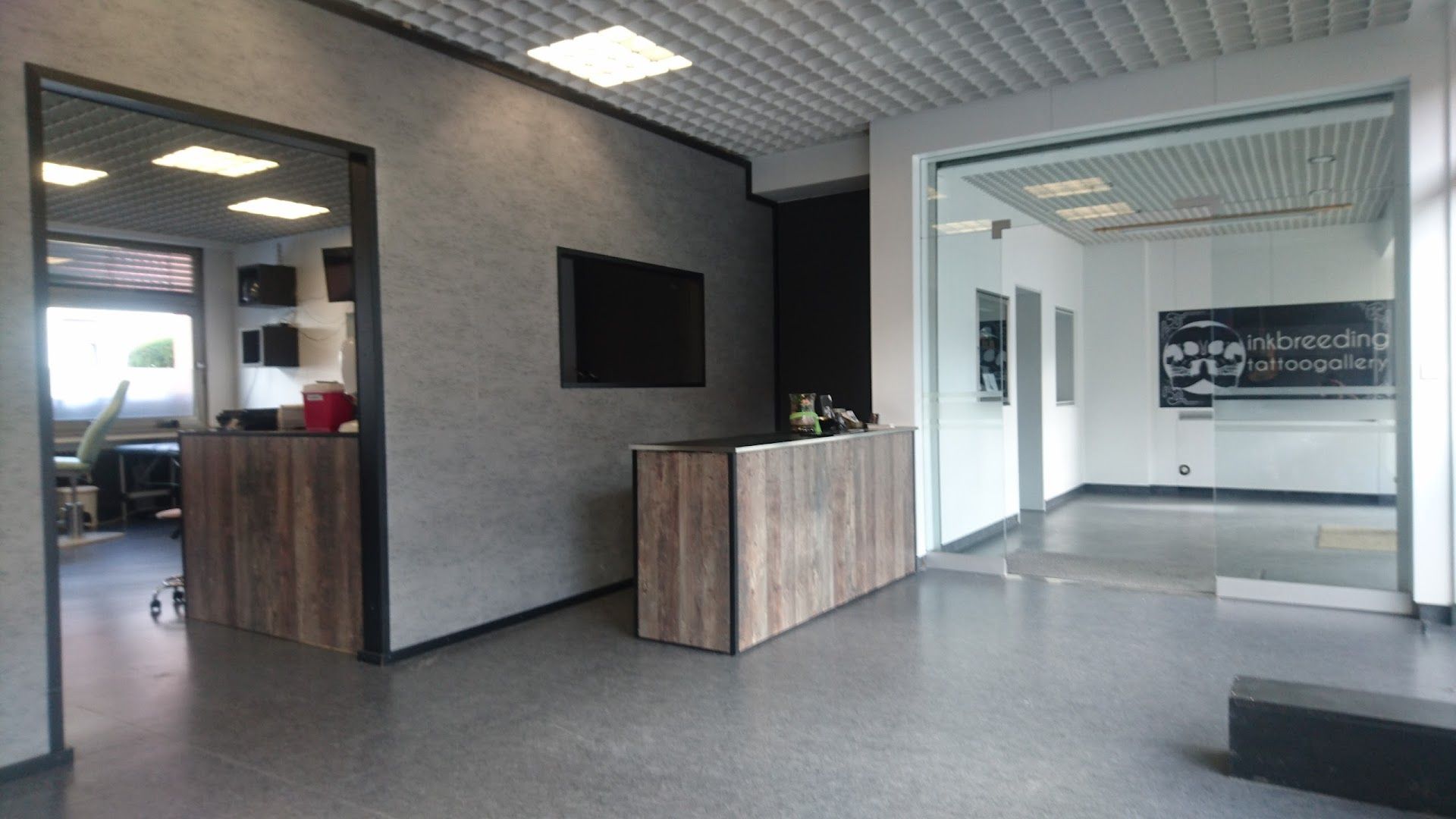 a large room with a television and a desk