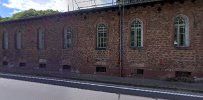 a brick building with a sign on the side