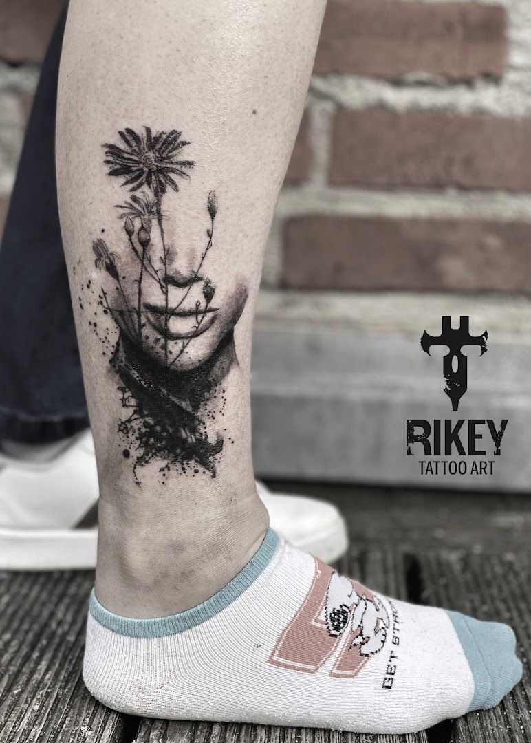 a cover-up tattoo of a man's face and palm trees, bayreuth, germany