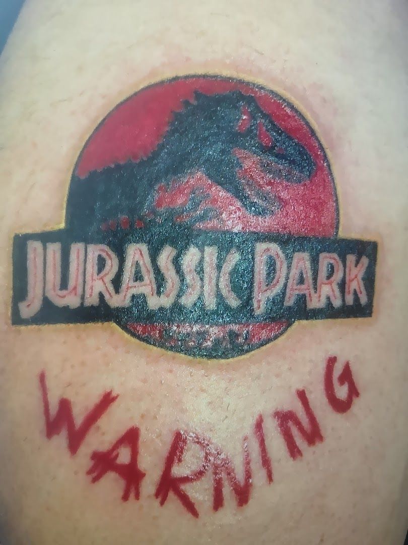 a narben tattoo with the words jurassic on it, ansbach, germany