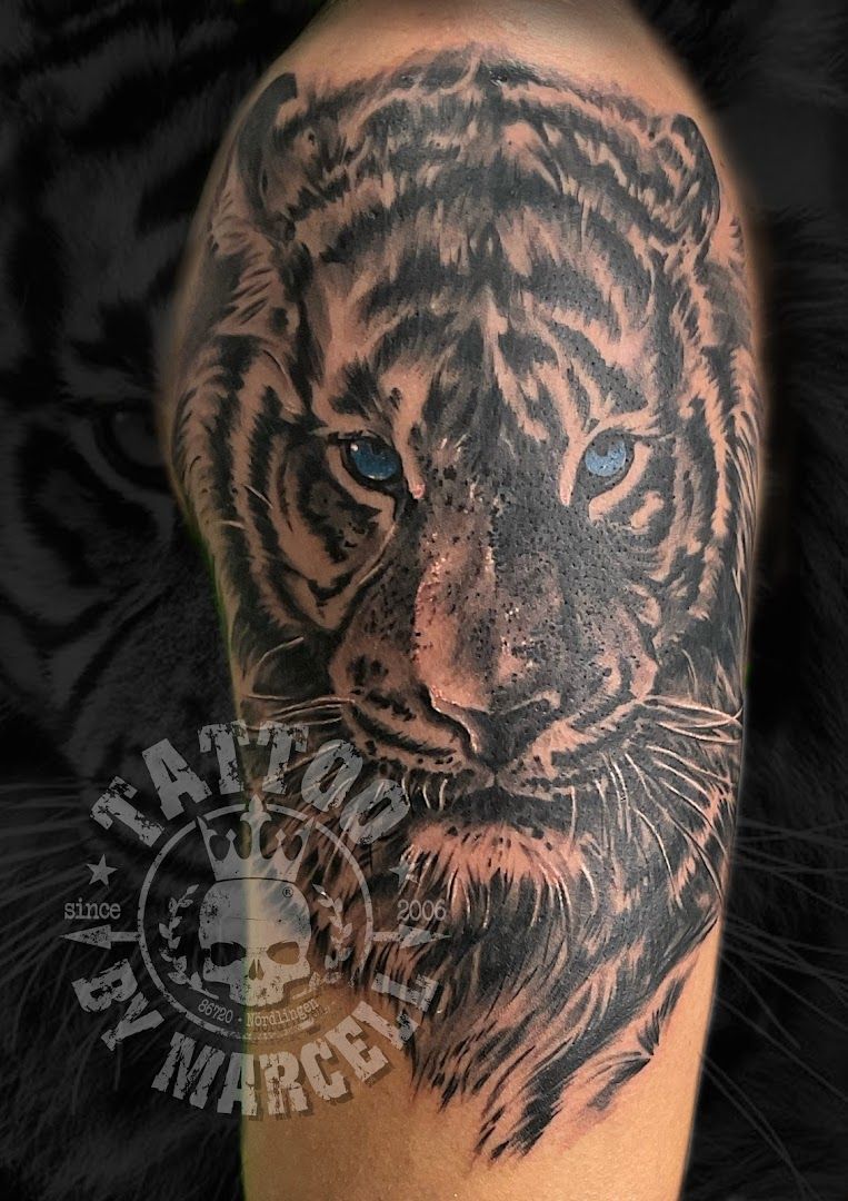 a black and white tiger cover-up tattoo on the arm, donau-ries, germany