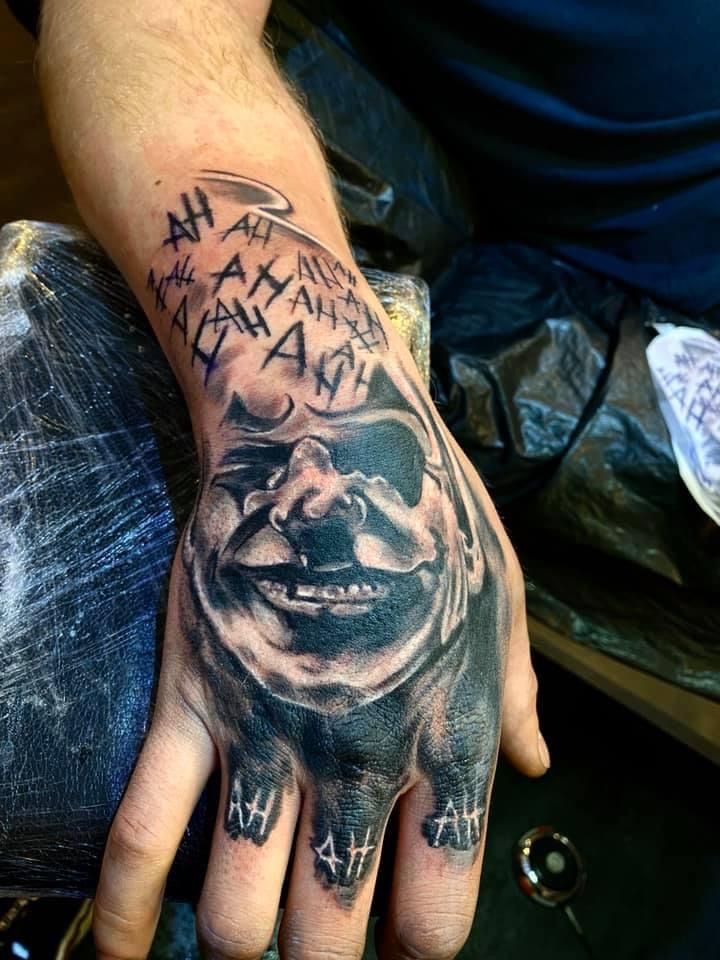 a man with a cover-up tattoo on his hand, bernkastel-wittlich, germany