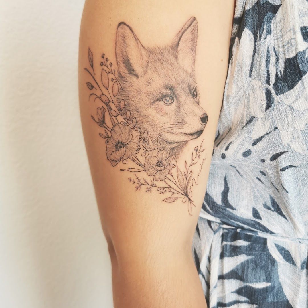 a narben tattoo of a fox with flowers on the arm, breisgau-hochschwarzwald, germany