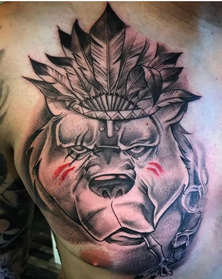 a cover-up tattoo of a lion with a leaf on his chest, kreisfreie stadt darmstadt, germany