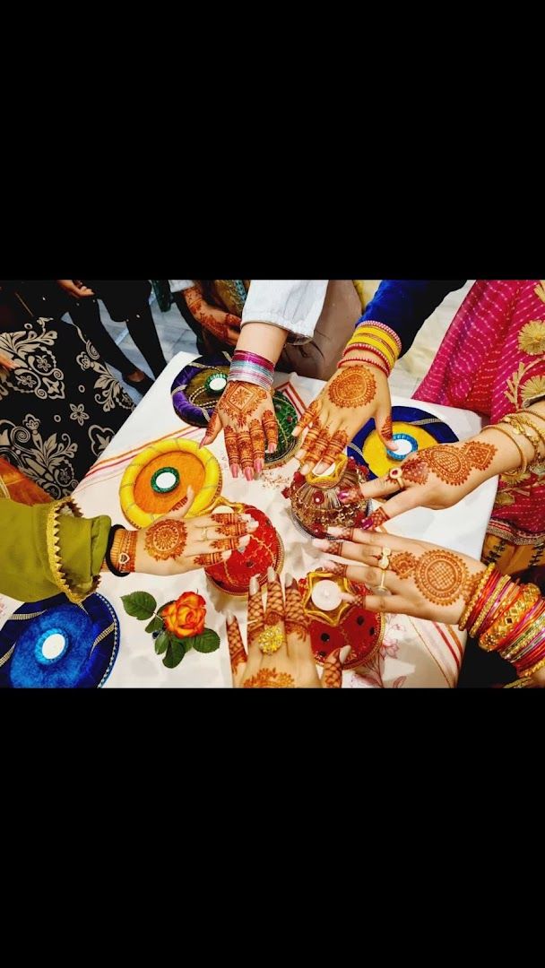 a group of people sitting around a table with henches