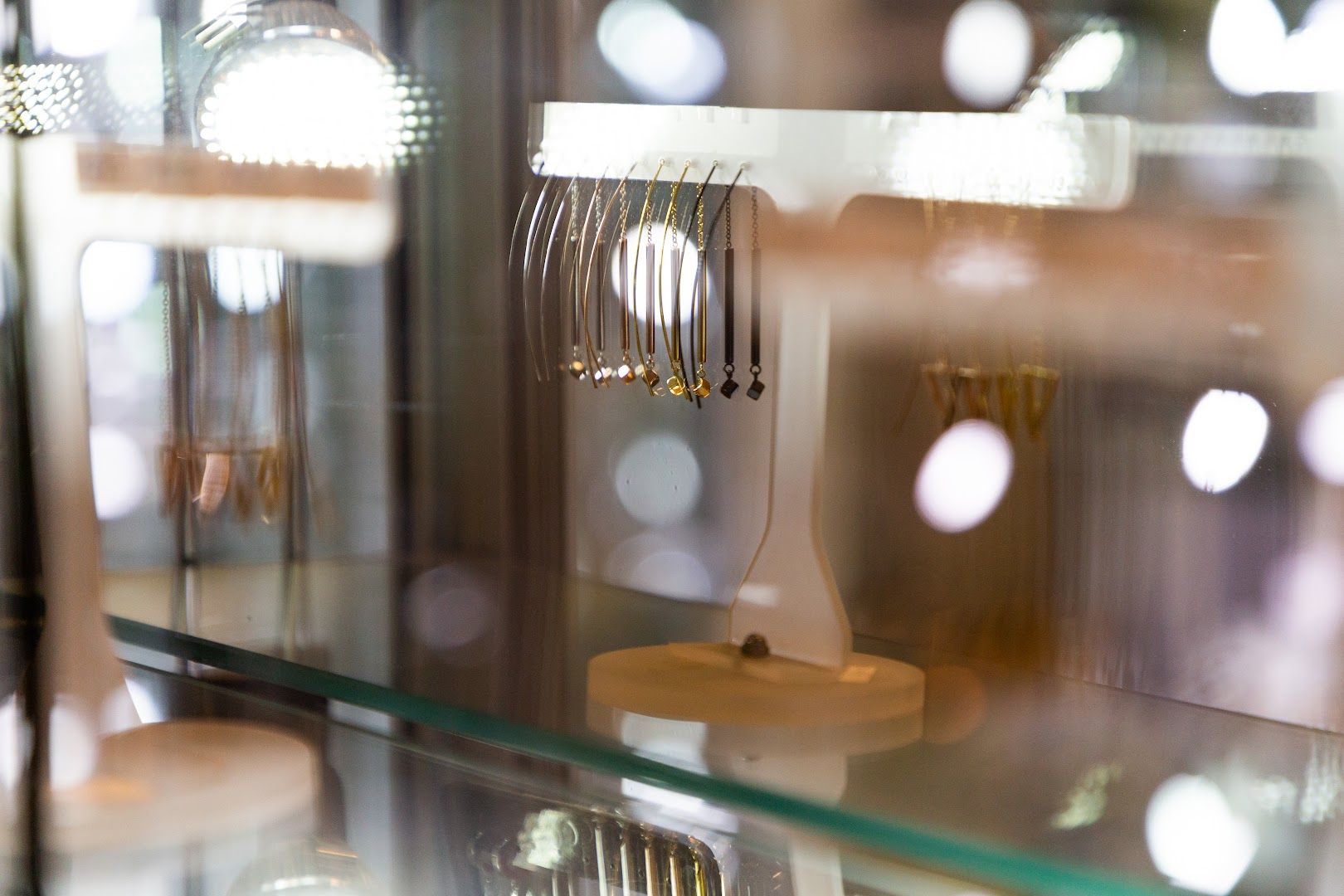 a display case with a fork and spoons