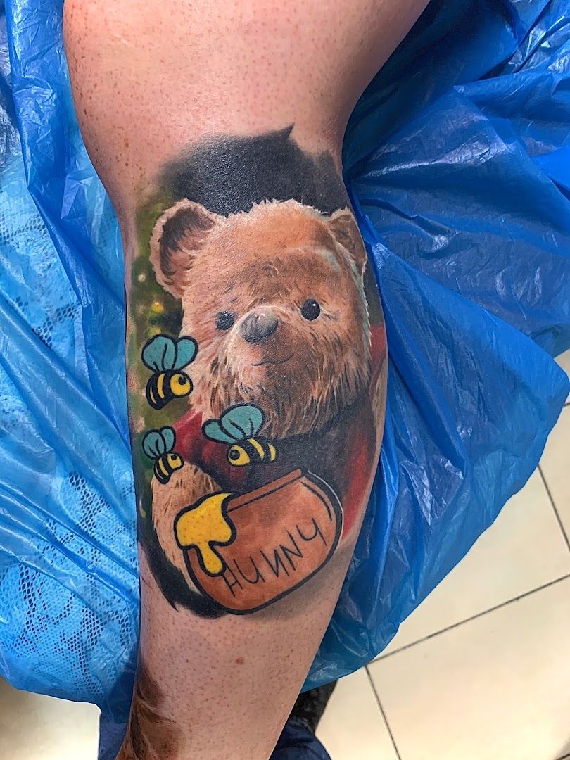a cover-up tattoo of a bear with a balloon, salzlandkreis, germany