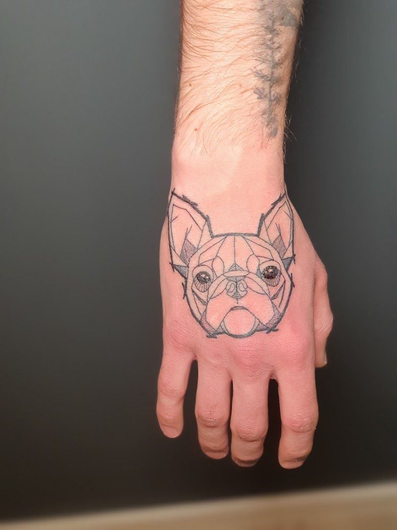 a narben tattoo of a dog on the hand, dresden, germany