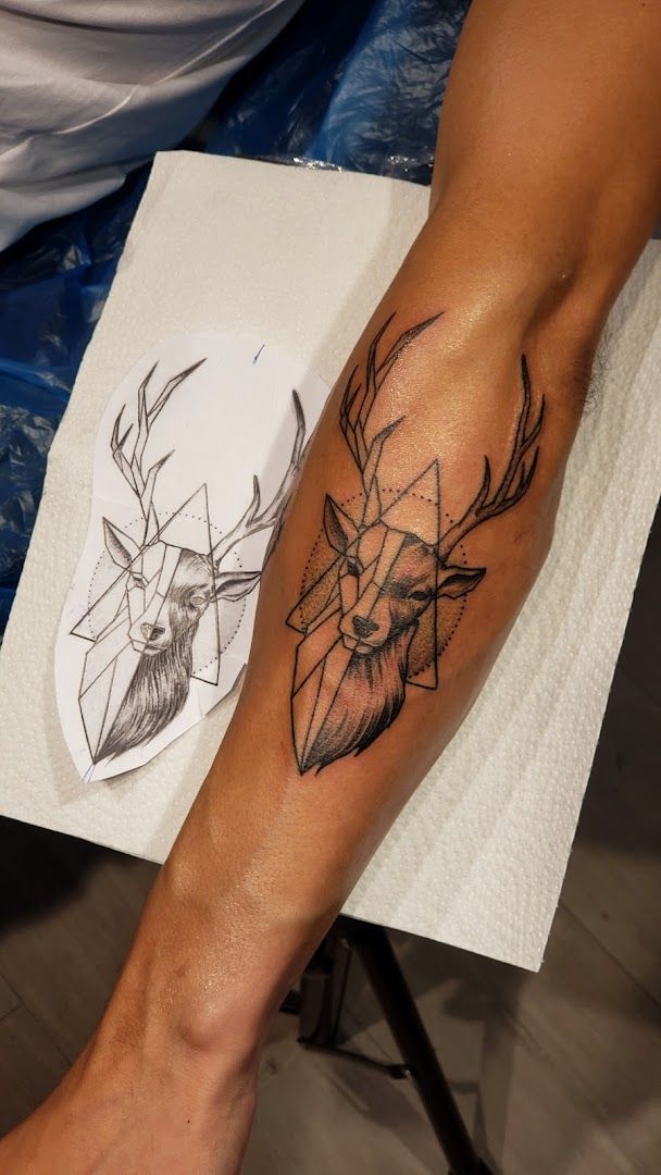 a narben tattoo of a deer and a deer head, dresden, germany