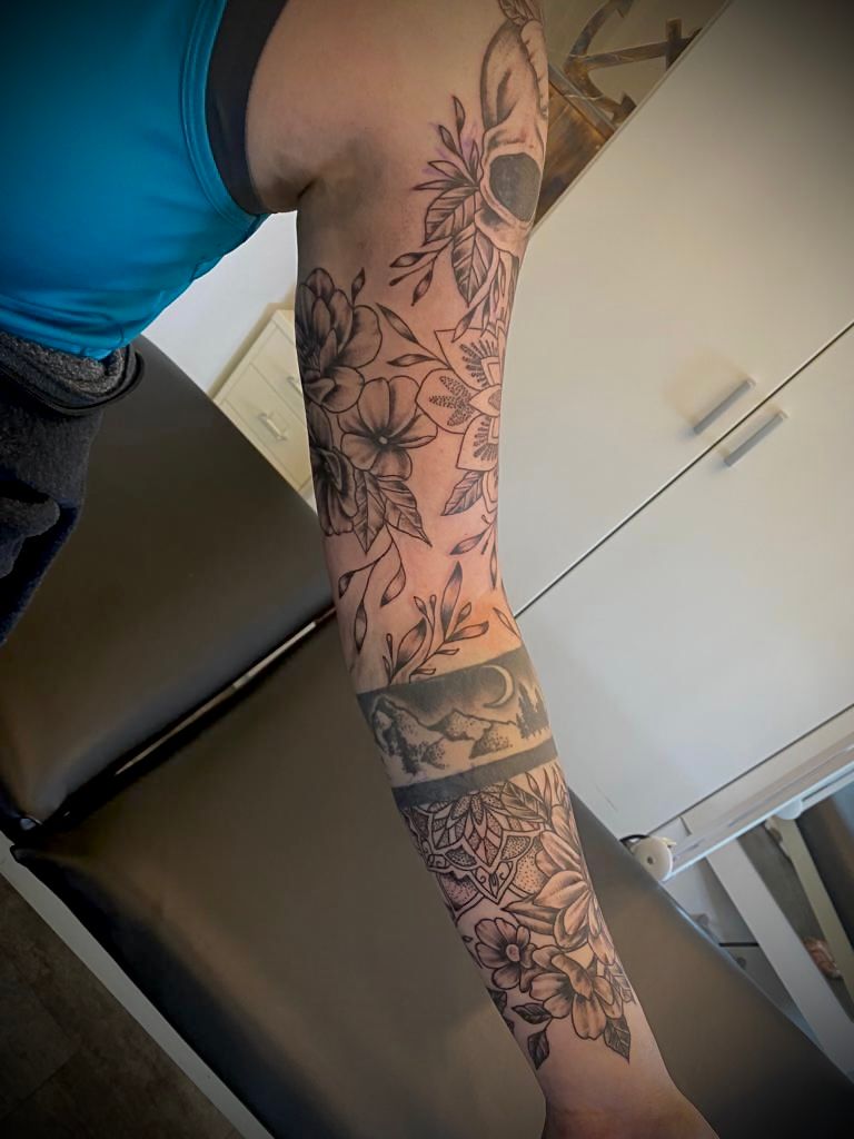 a woman with a cover-up tattoo on her arm, kaiserslautern, germany