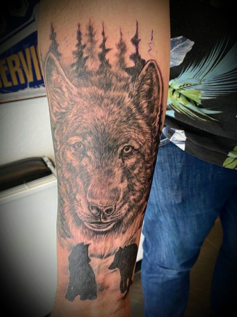 a wolf cover-up tattoo on the arm, rastatt, germany