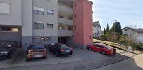 a parking lot with cars parked in front of it