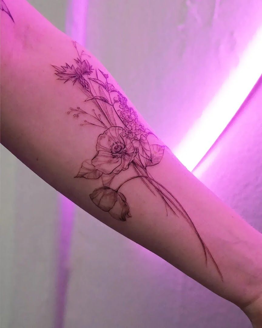 a narben tattoo with a flower on the arm, essen, germany