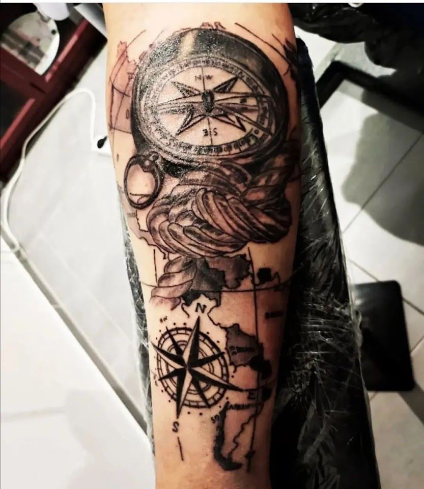 a cover-up tattoo with a compass and a compass on it, soest, germany