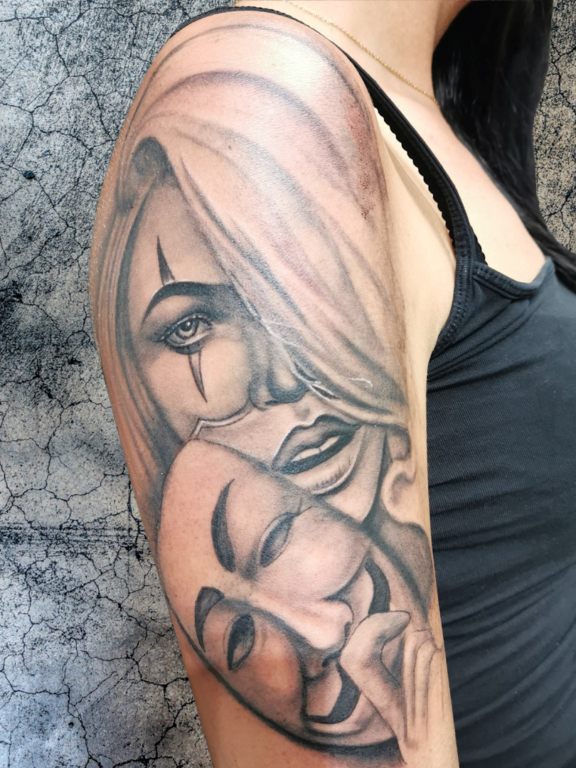 a woman with a face portrait tattoos on her arm, hamburg, germany