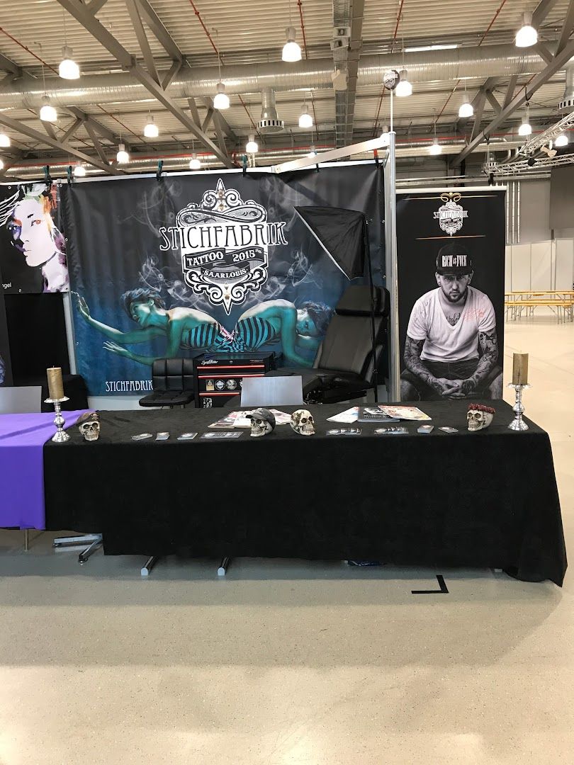 a table with a black table cloth and a black table cloth