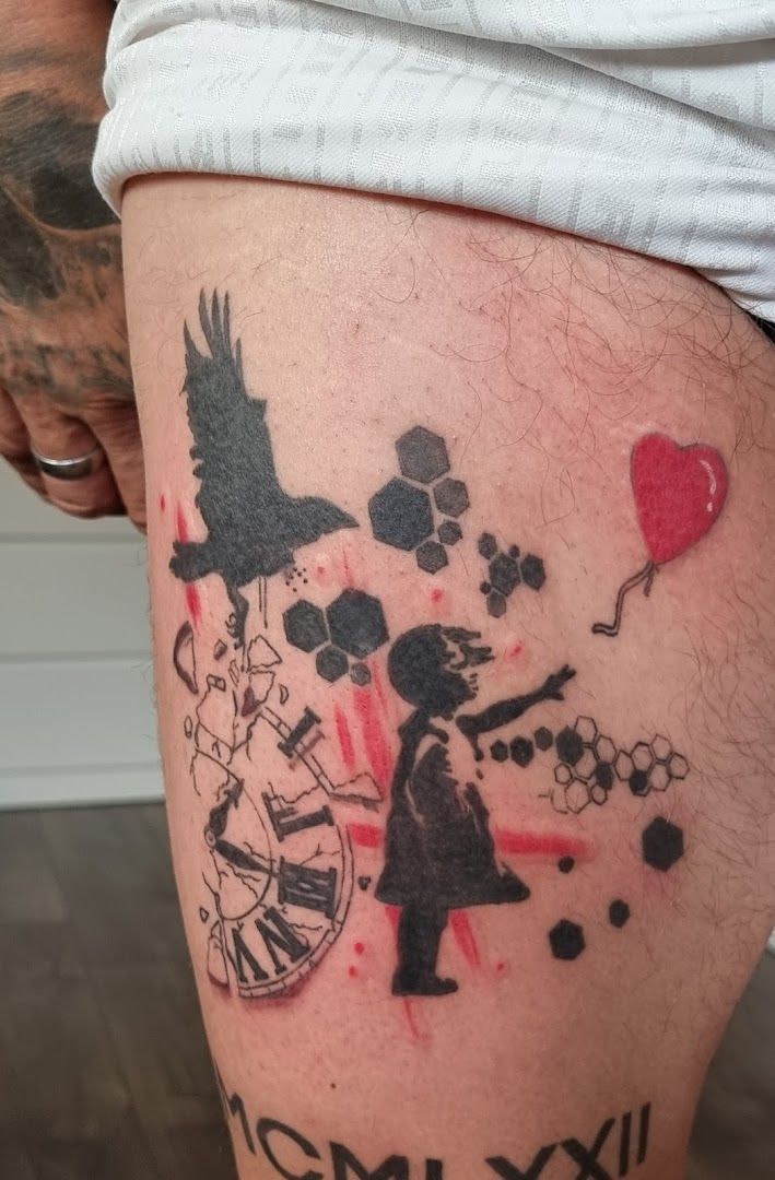 a cover-up tattoo with a black and red ink on the leg, peine, germany