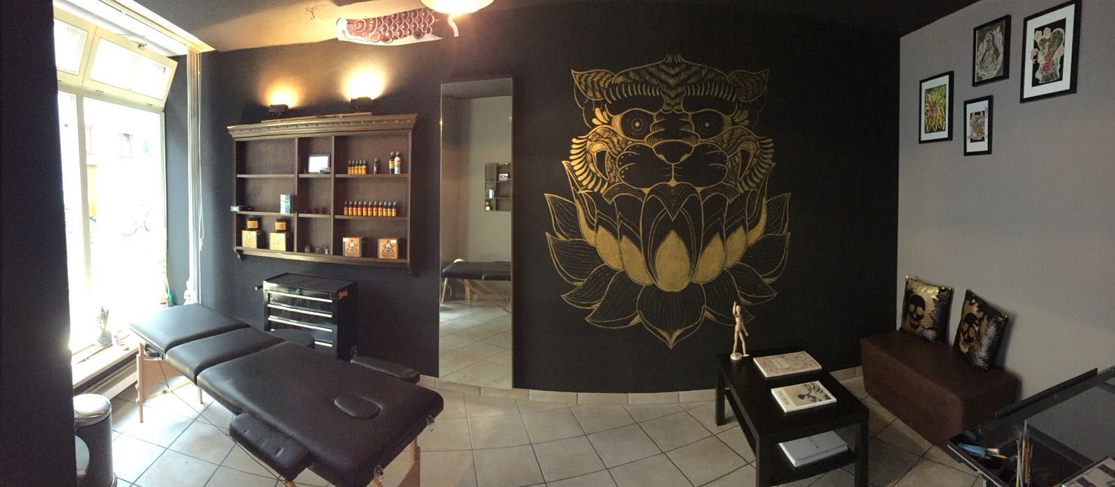a room with a black wall and a black chair