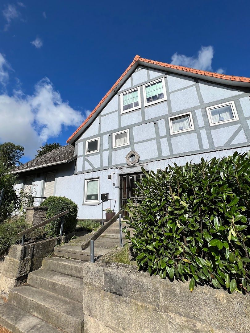a house with a blue sky in the background