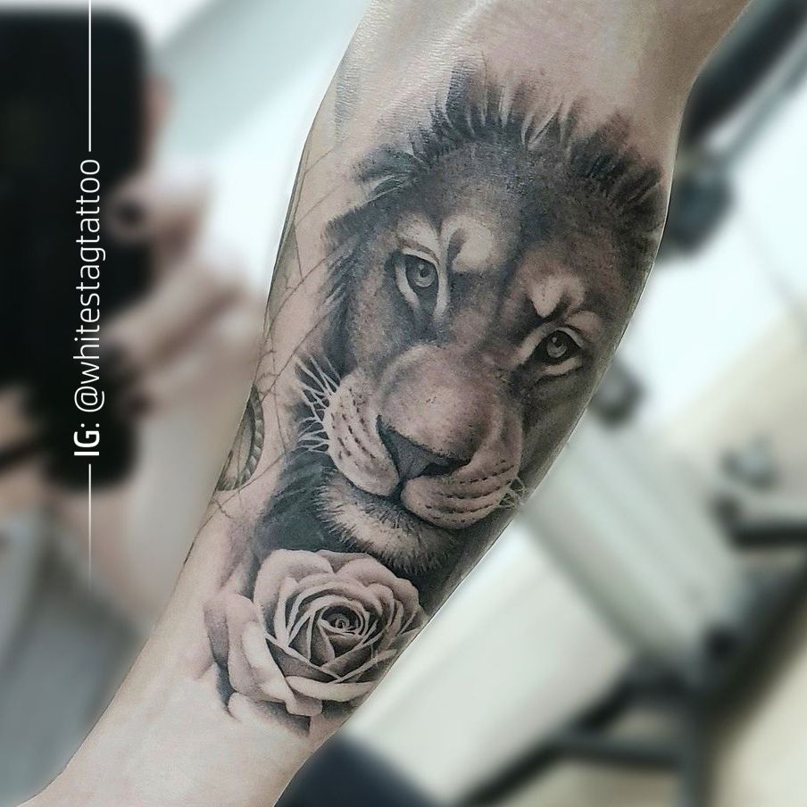 a lion and rose cover-up tattoo on the forearm, vogelsbergkreis, germany