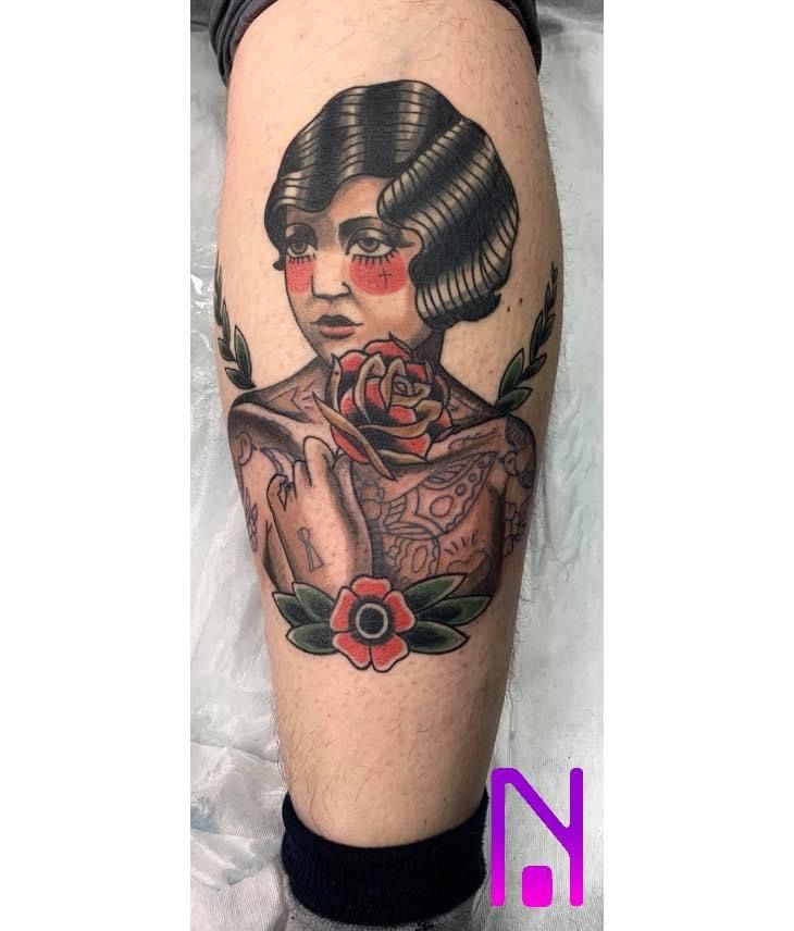 a narben tattoo of a woman with a flower on her arm, hamburg, germany