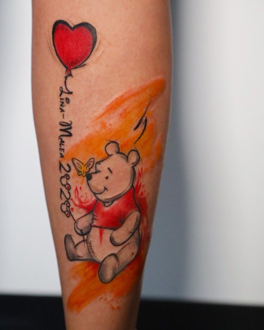 a realistic tattoos with a heart and a bear, ansbach, germany
