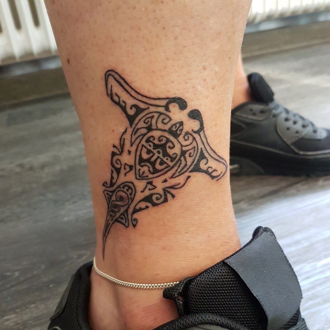 a cover-up tattoo on the ankle of a woman, lippe, germany