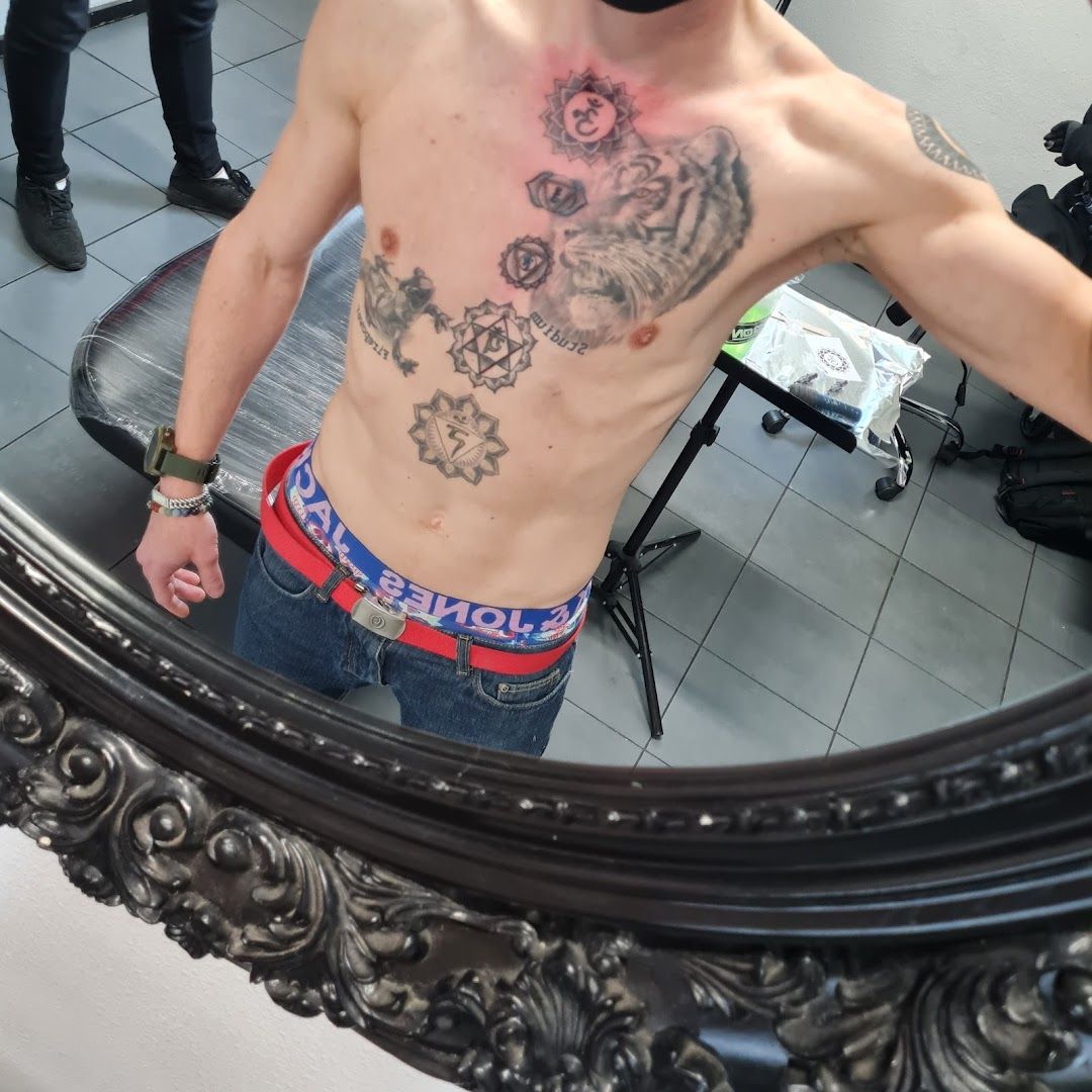 a man with a blackwork tattoo on his chest, frankfurt, germany