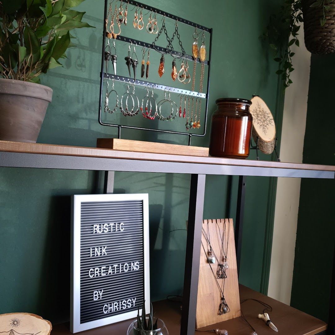 a shelf with a sign and a pot of plants