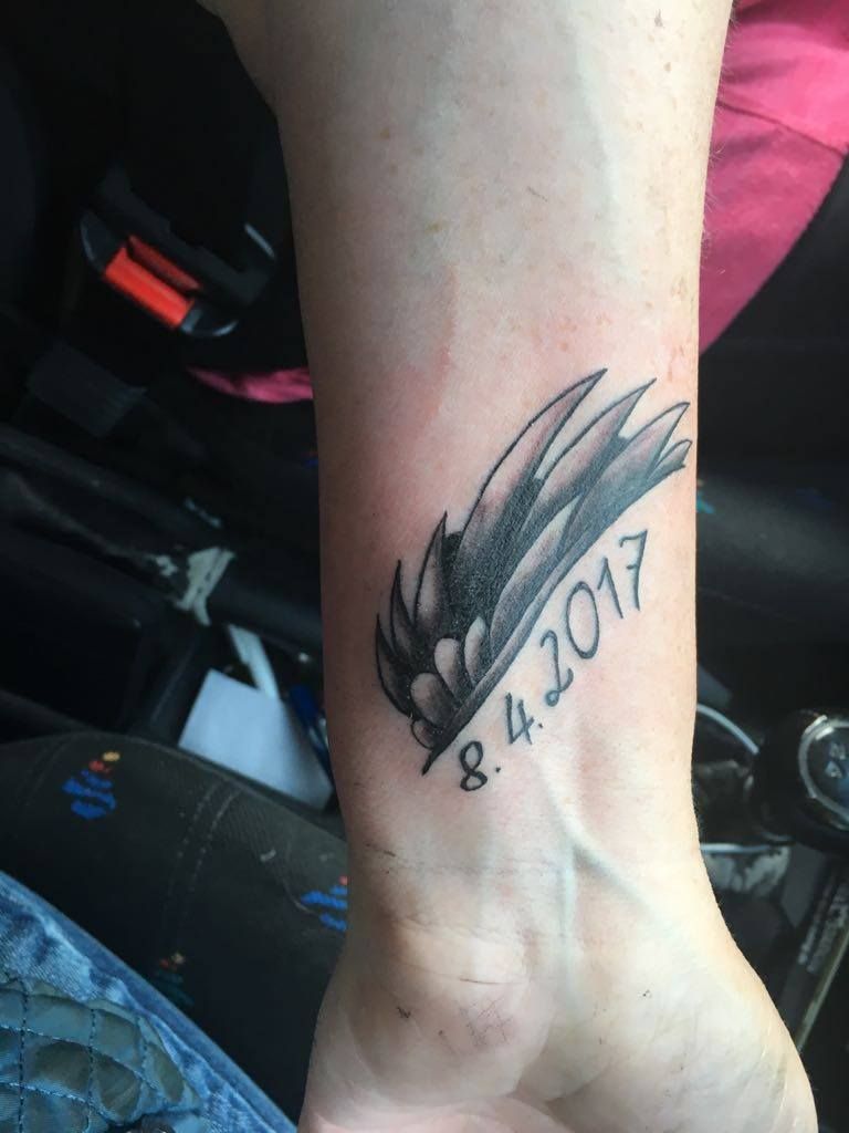 a cover-up tattoo of a bird on the wrist, lippe, germany