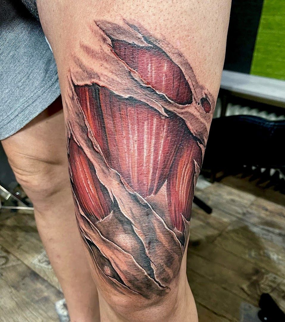 a narben tattoo of a red and black piece of wood, bonn, germany