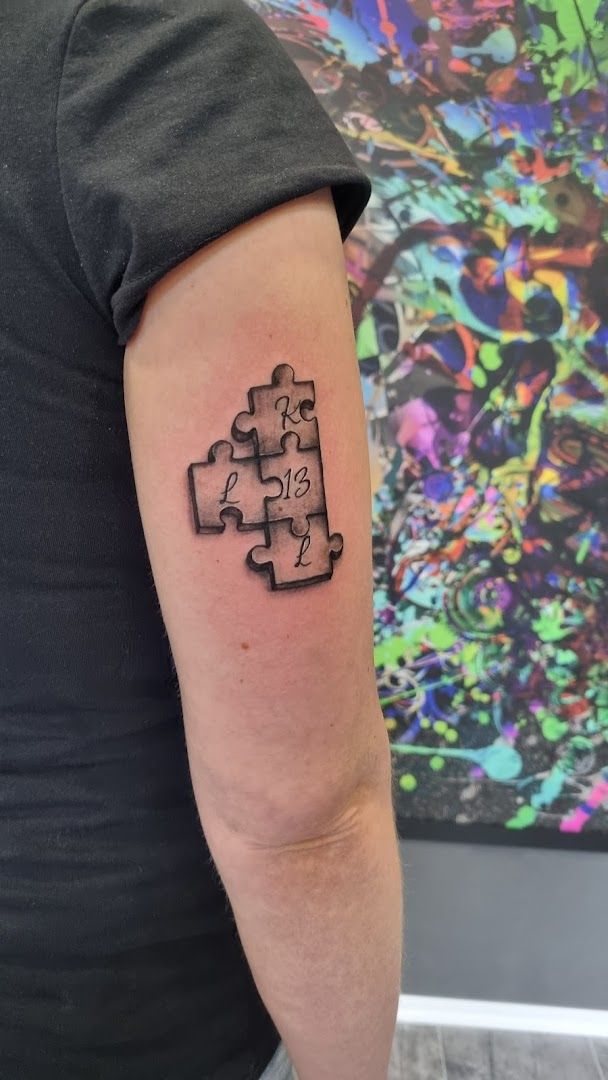 a black and white japanische tattoos in leipzig of a puzzle piece, delmenhorst, germany