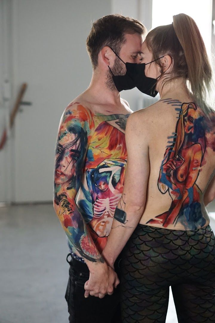 a man and woman with japanische tattoos in leipzigs on their backs, kreisfreie stadt heilbronn, germany