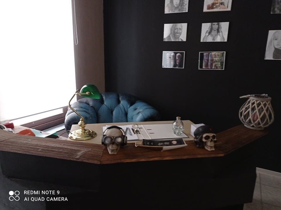 a desk with a laptop and a camera