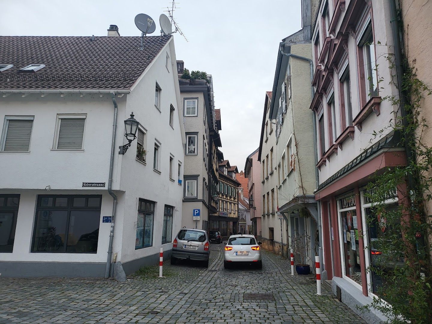 a car parked in a cobbed street