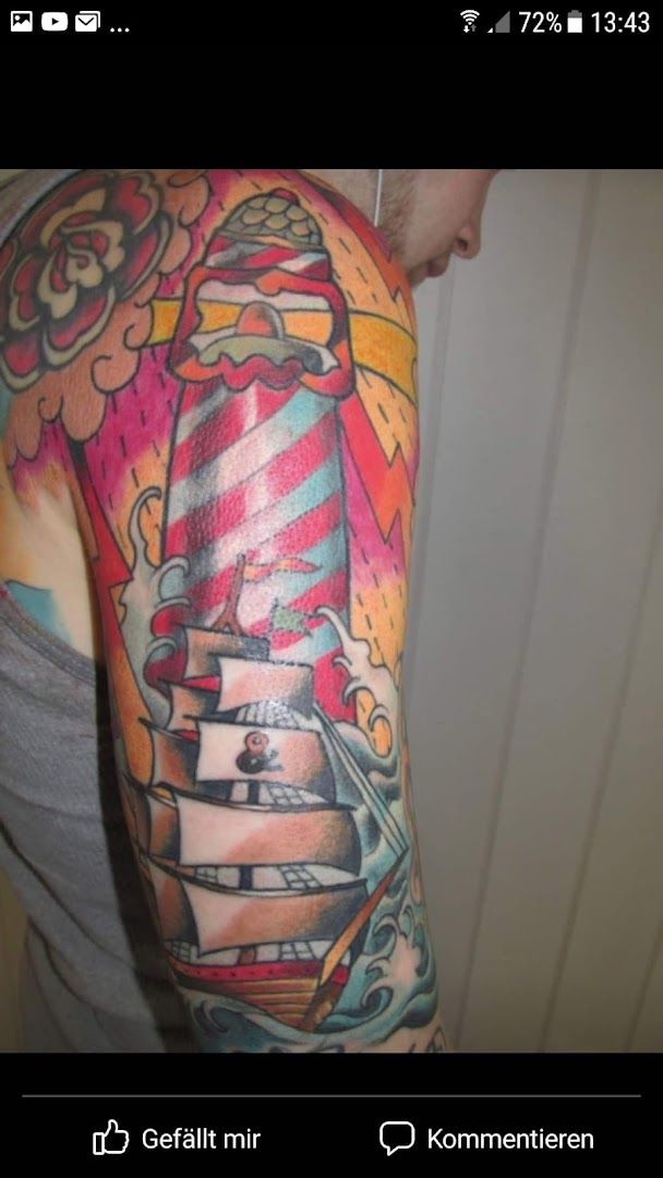 a man with a colorful cover-up tattoo on his arm, kaiserslautern, germany