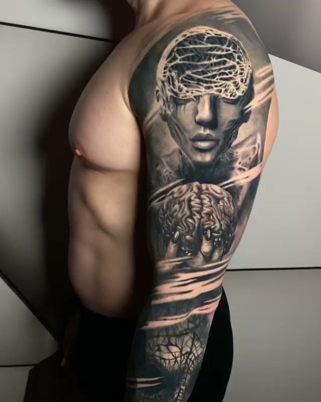 a man with a cover-up tattoo on his arm, berlin, germany